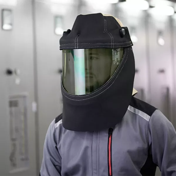 A man is wearing a protective hood.