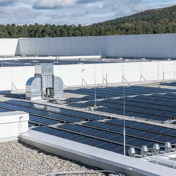 A large building with a lot of solar panels on top of it